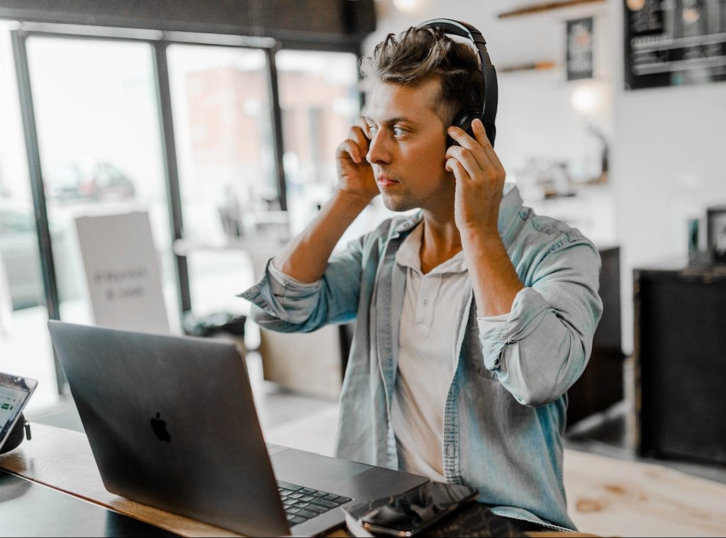 men's blue collared top near silver MacBook